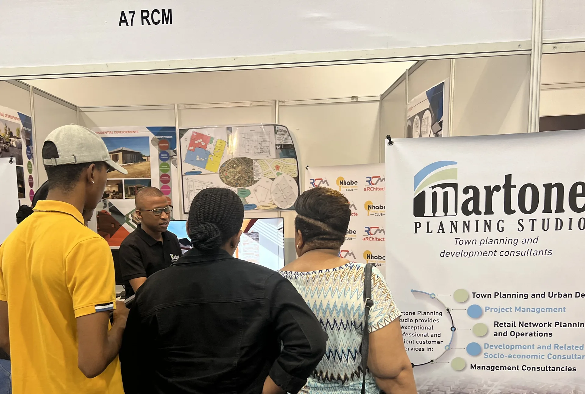Martone Planning Studio exhibition booth with residential development boards on display